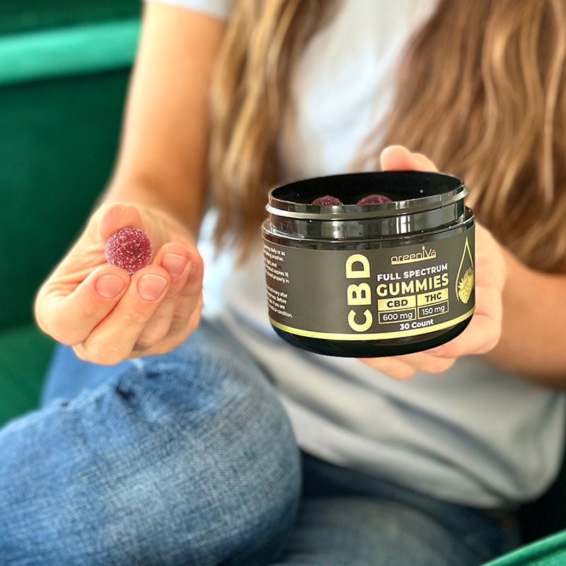 GreenIVe CBD + THC Full Spectrum Gummies in women's hand.